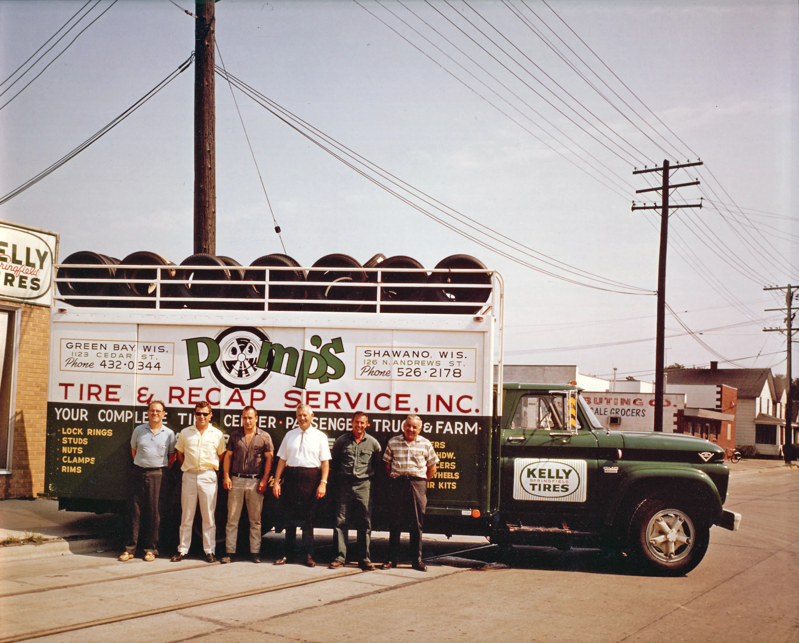 Pomp's Tire Service team with delivery truck, circa 1960s