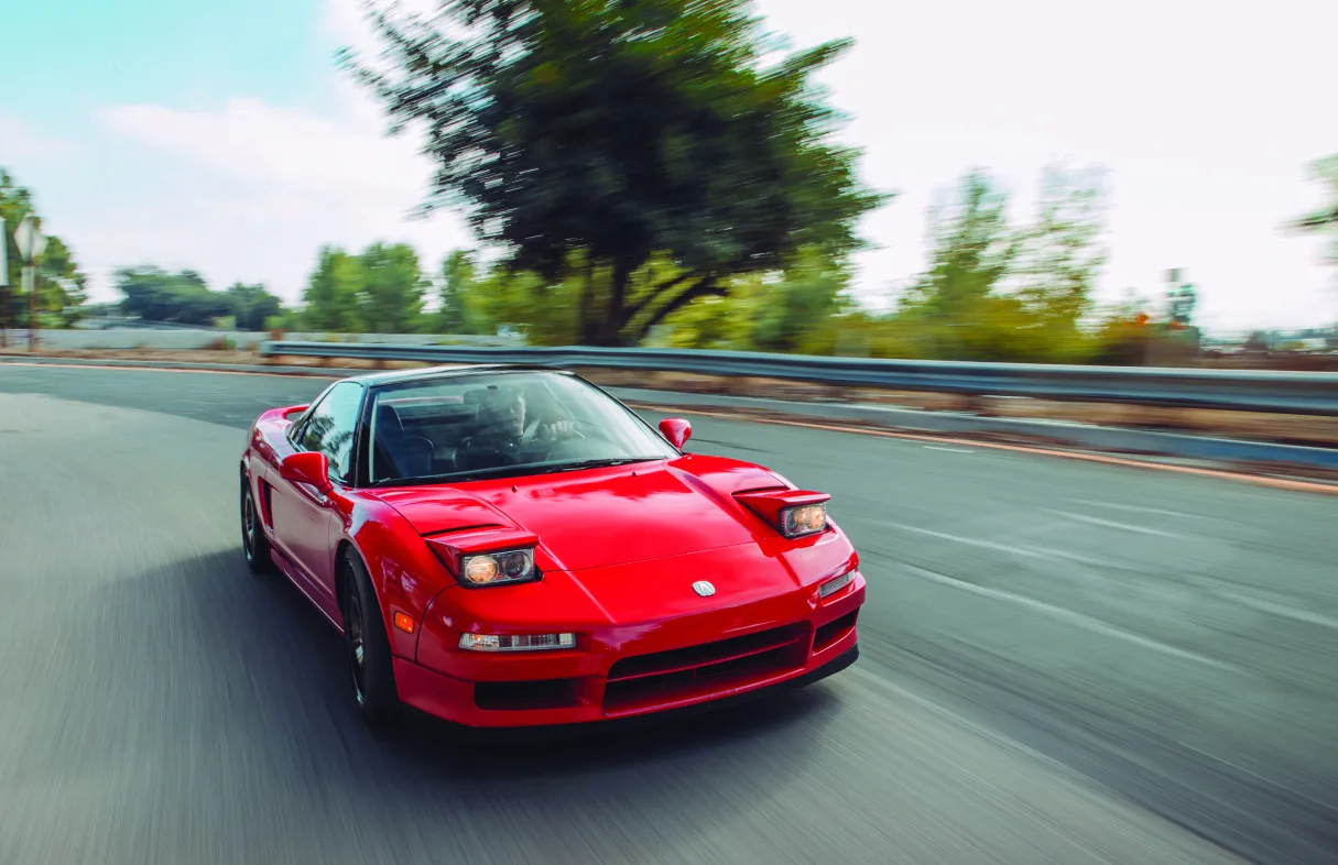 Red performance car on a racetrack