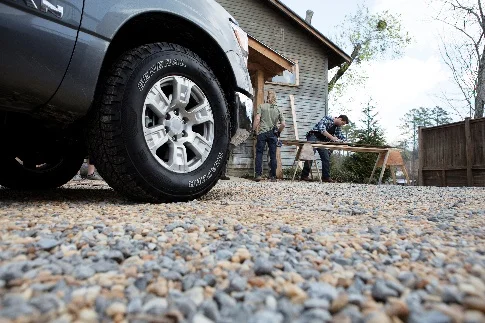 General Tire on pickup truck on gravel