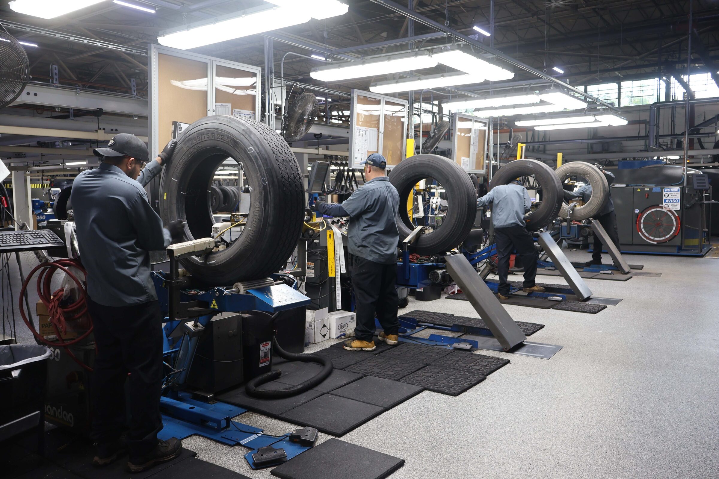 Technicians servicing tires at Pomp's Waukegan retread facility